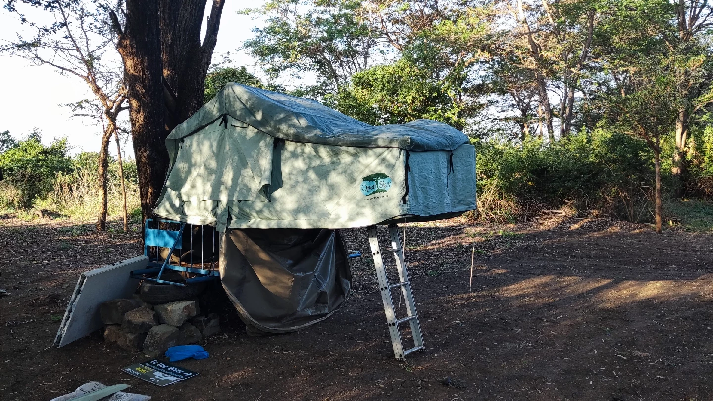 Rooftop tent and ladder