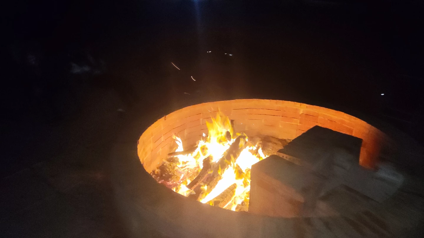 Flames glowing in Thiba River Camp fire pit